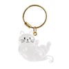 A clear, sculpted cat charm attached to a gold-colored chain keychain.