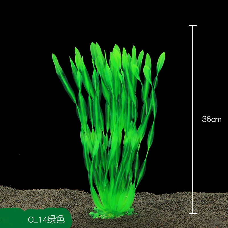 A clump of bright green artificial aquarium plants growing in sand.