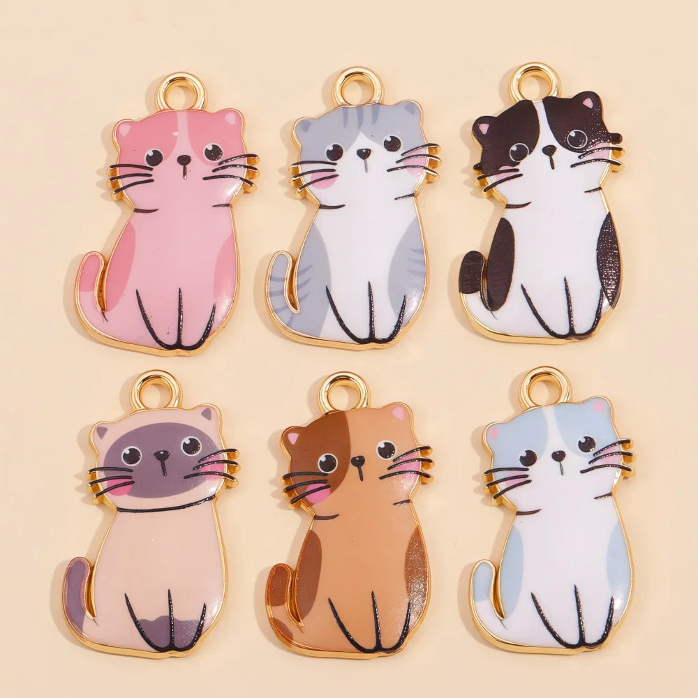 A collection of colorful cat and animal pendant charms in various shades of pink, gray, brown, and blue.