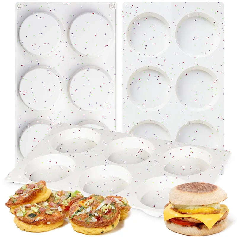 A set of non-stick silicone egg molds used for making breakfast sandwiches and baking.