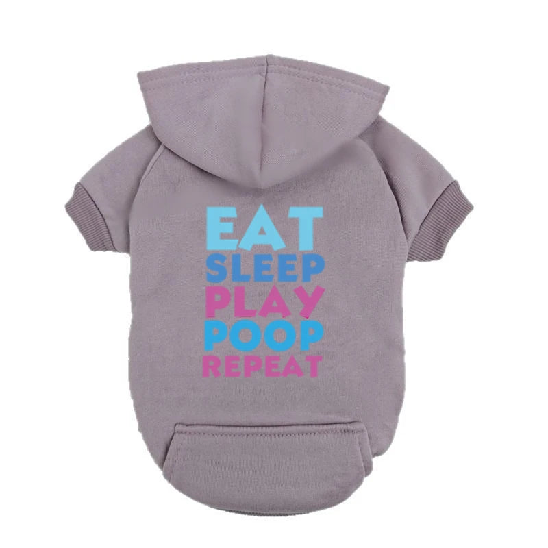 A light purple dog hoodie with a hood and text that reads Eat Sleep Play Poop Repeat