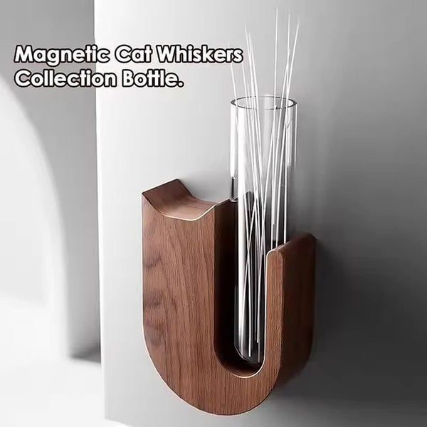 A wooden magnetic cat whiskers collection bottle with thin, vertical wires inside.