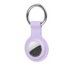 A purple silicone protective cover for an AirTag attached to a silver keychain ring.
