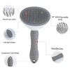 A gray pet hair remover grooming brush with a silicone head, anti-skid button, and suspension hole design.