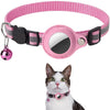 Pink woven collar with a silver AirTag holder and breakaway buckle, shown next to a cat.