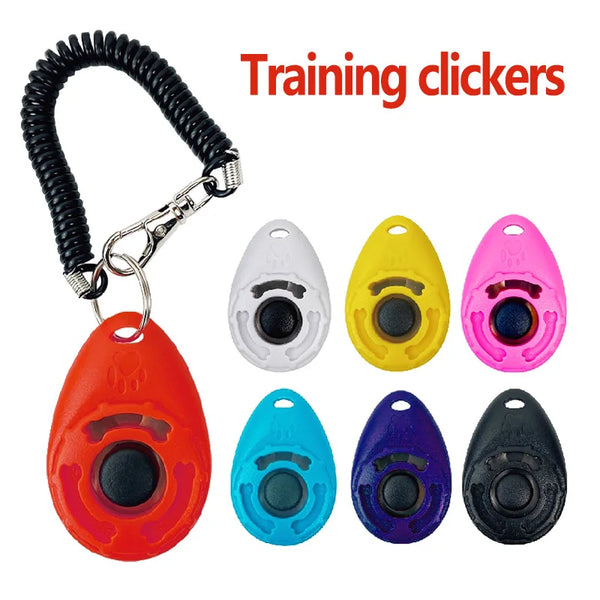 A set of five training clickers in various colors including red, white, yellow, pink, blue, and black.