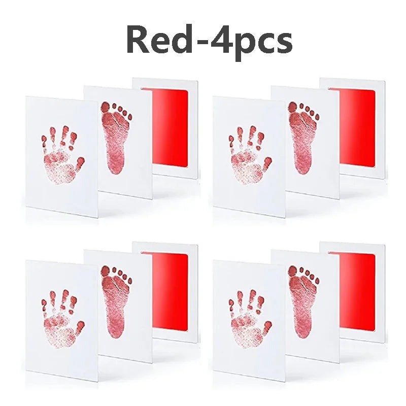 Four red baby handprint and footprint cards displayed on a white background.