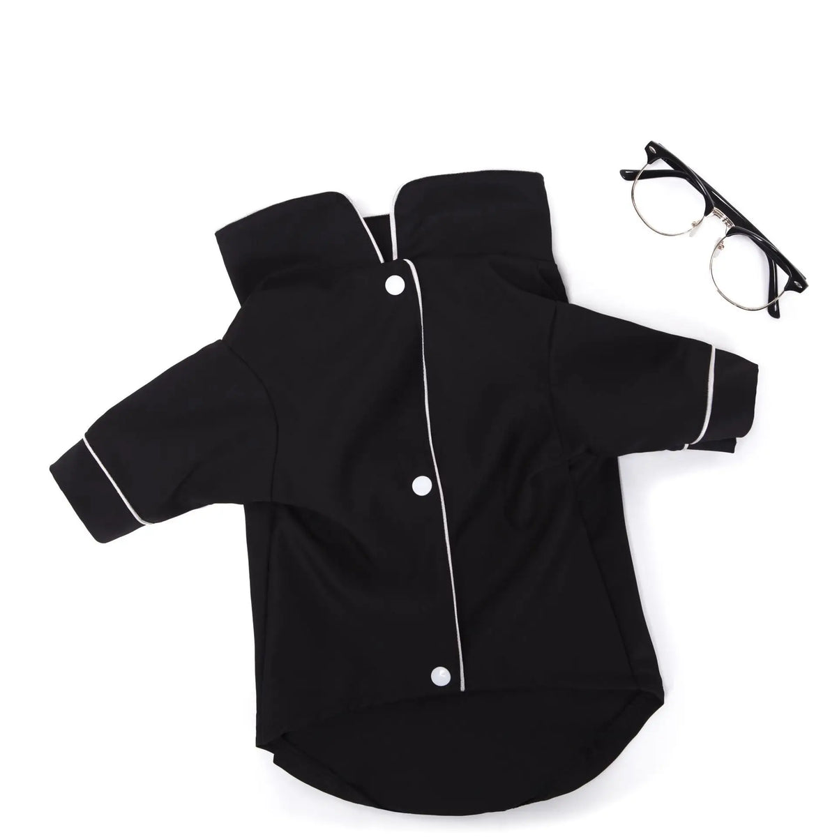 Black luxury silk pet pajamas for a small dog lying flat.