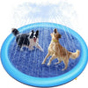 A dog is splashing in a blue water feature, creating a spray of water against a blue background.
