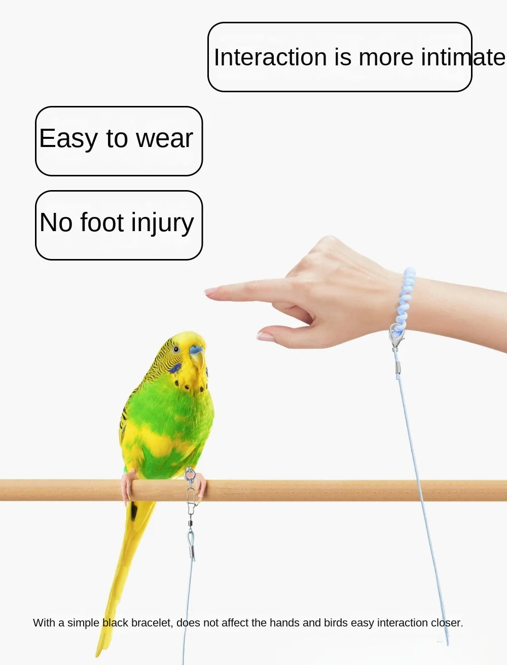 A yellow and green parrot is perched on a wooden bar, being gently handled by a person's hand.