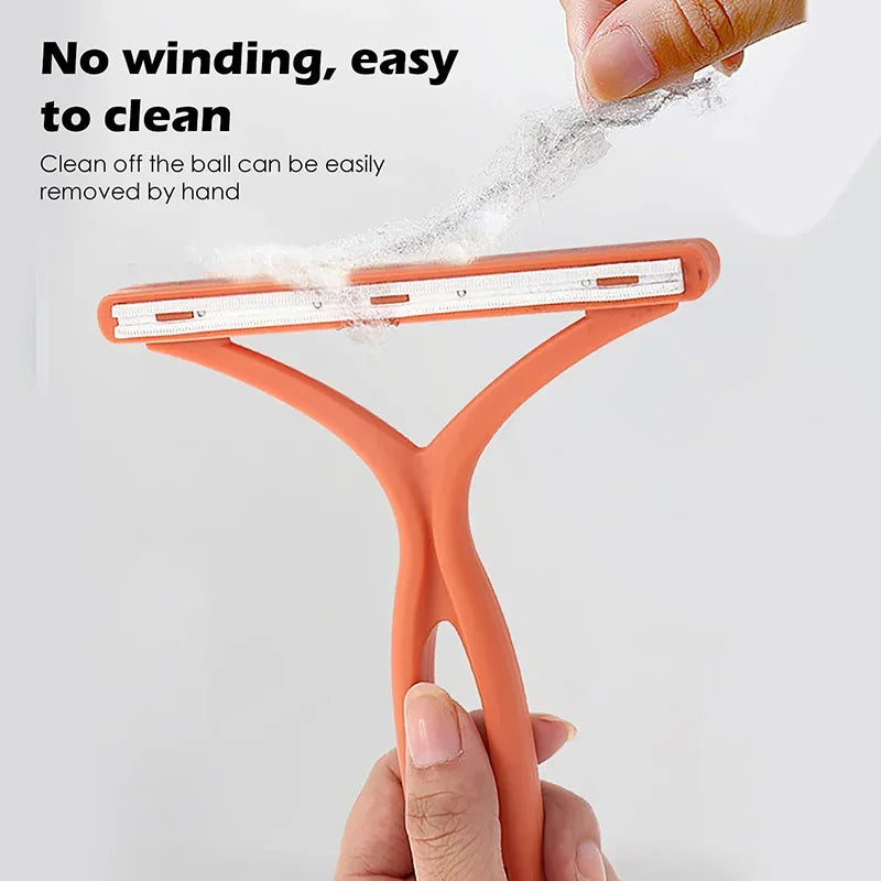 An orange silicone tool used to clean pet hair off a ball, demonstrating its easy removal feature.