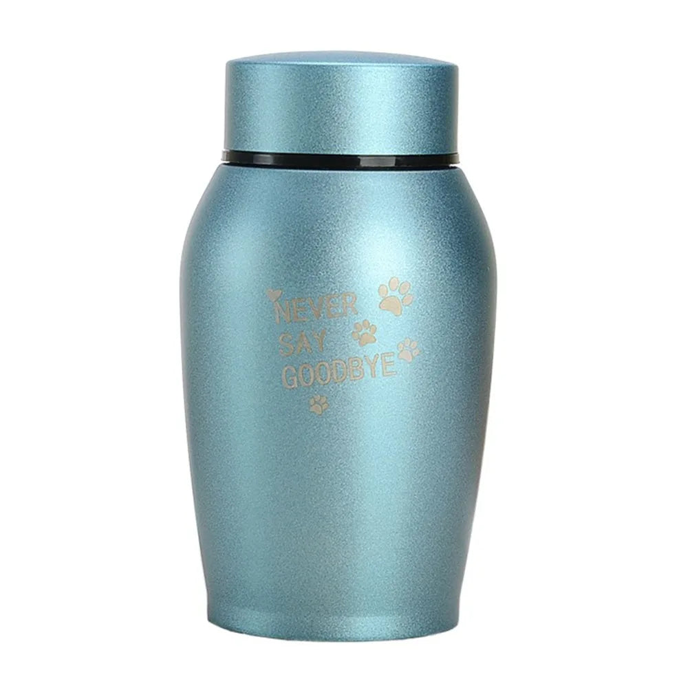 A teal stainless steel pet memorial storage box with a sliding cap.