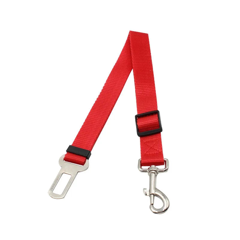 Red retractable dog car seatbelt tether with a metal clip and buckle.