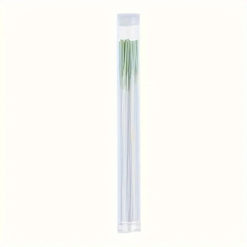 A clear tube containing a set of disposable ear cleaning tools.