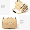 A beige breathable pet carrier bag for cats and small dogs shown in a top-down view.