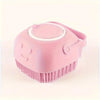 A pink gentle dog bath brush with a shampoo dispenser is shown from above.