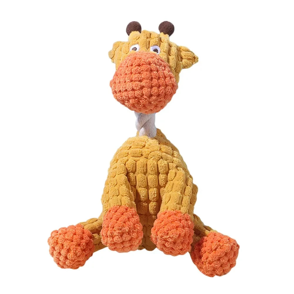 A yellow bottle-shaped squeaky plush dog toy with large orange ears and features.