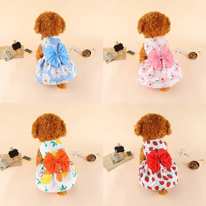 A collection of four pet outfits featuring summer bow dresses for small dogs and cats in floral patterns.