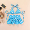 Blue polka dot summer pet swimsuit for dogs and cats displayed on a light background