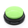 A round, lime green button with a black base for dog training.