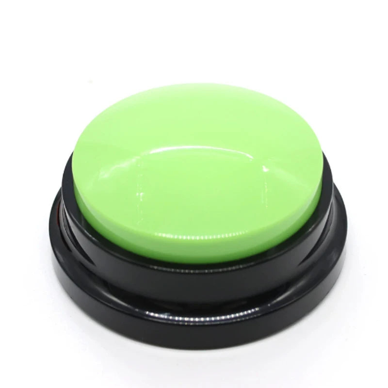 A round, lime green button with a black base for dog training.