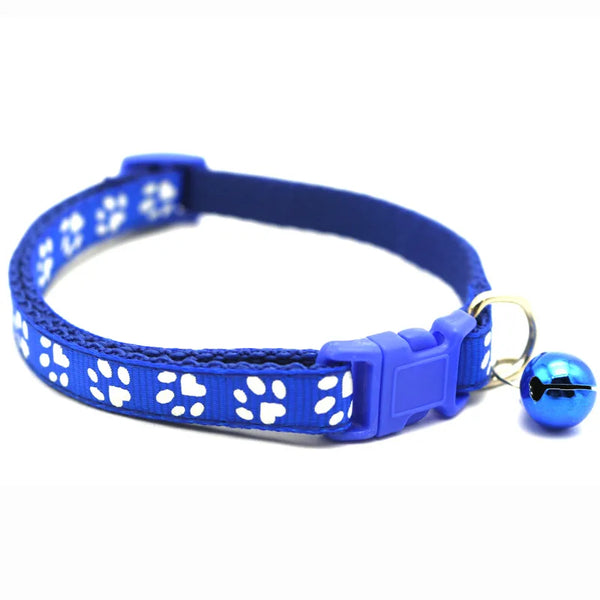 Blue adjustable pet collar with white cartoon paw prints and a silver bell.