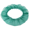 A circular skirt made of sheer teal nylon mesh used as a debris guard for a bird cage seed catcher.