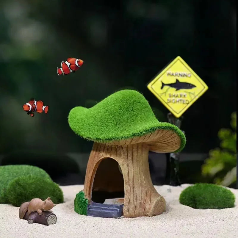 A resin aquarium house decor featuring a tree-like hiding shelter, a small rodent, and a warning sign for sharks.