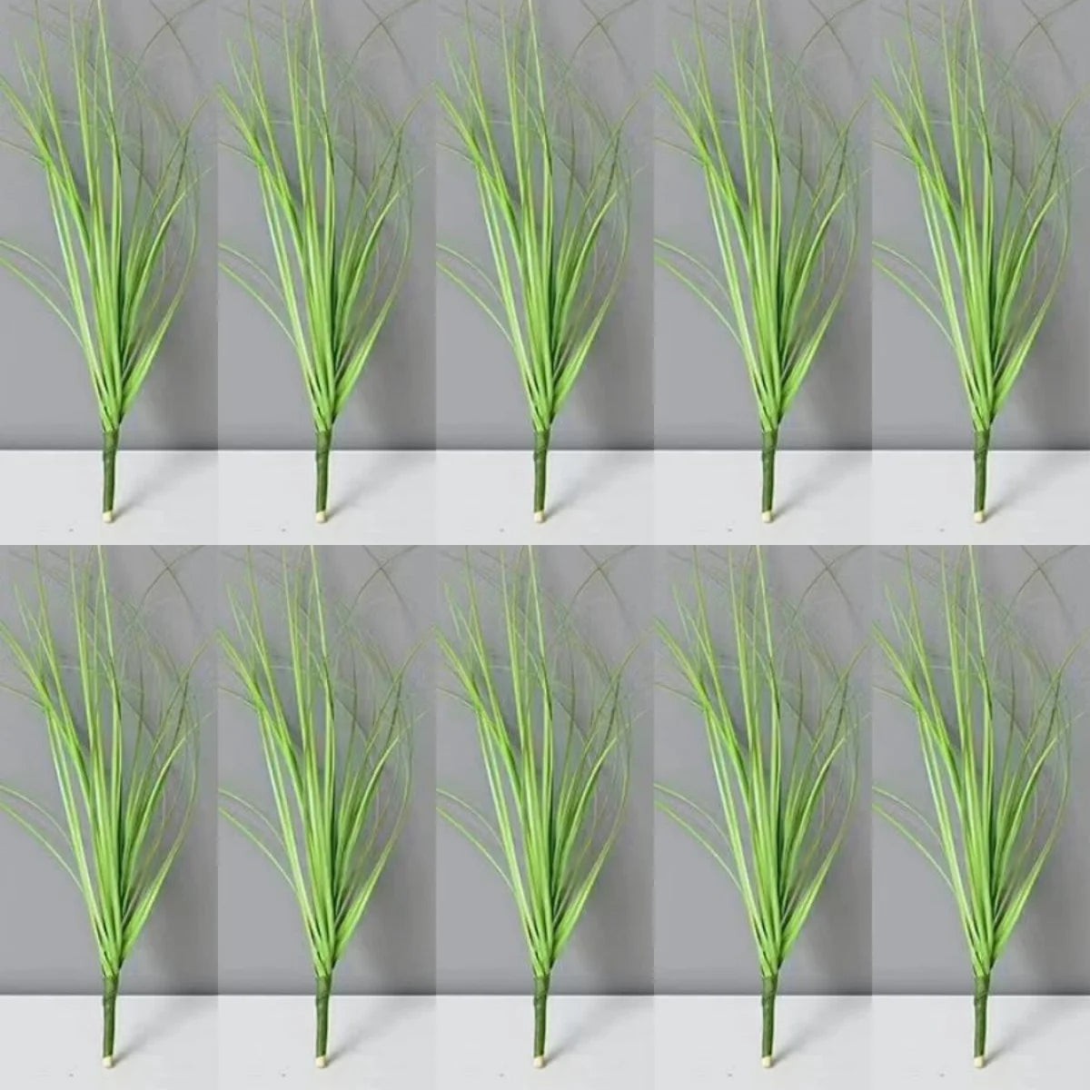 Un ensemble de plantes décoratives miniatures de gazon d'oignon simulé dans diverses nuances de vert.