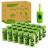 A box of poop bags with 20 rolls and a stack of green biodegradable dog waste bags.