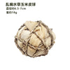 A tightly woven ball made of natural grass, used as a chew toy for small pets.