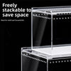 Un terrarium pour reptiles clair et empilable, montré sur fond noir.
