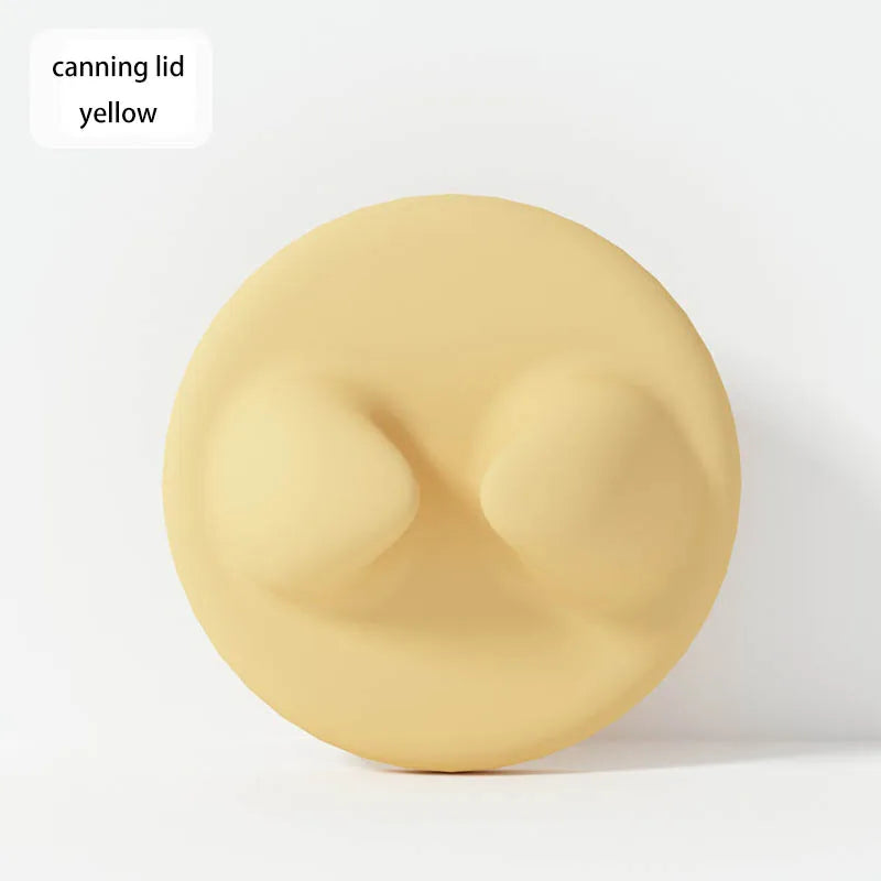 A yellow silicone canning lid product shown in a close-up view.