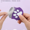 A purple pet grooming comb is shown being used to remove loose hair from a pet's fur.
