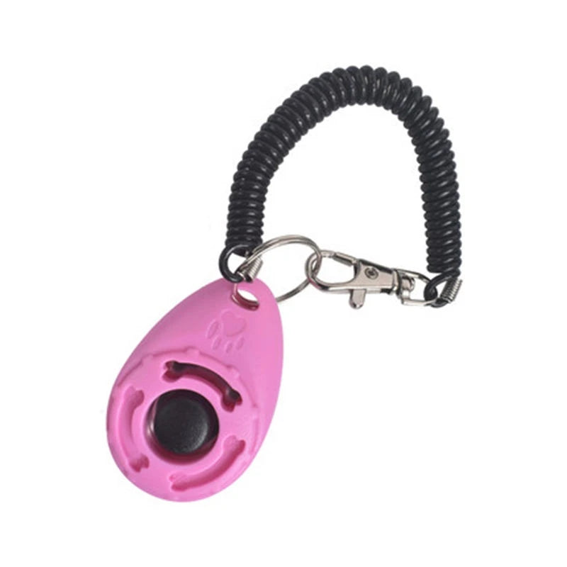 Rosa Hundetrainer-Klicker mit schwarzem Gummiband und Metallclip.