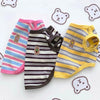 A set of striped stretchy pet tank tops for cats and small dogs in pink, purple, and yellow.