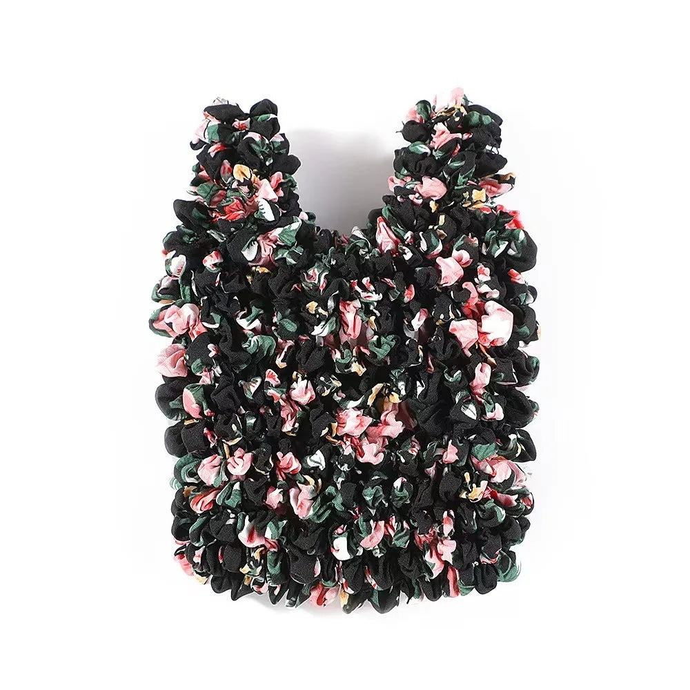 A black and pink floral fabric reusable foldable bubble shopping bag