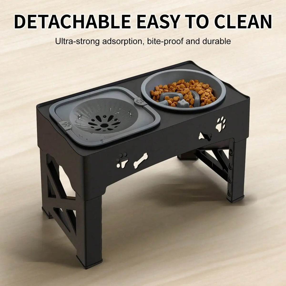 A black detachable elevated dog bowl stand with a stainless steel bowl for pet food