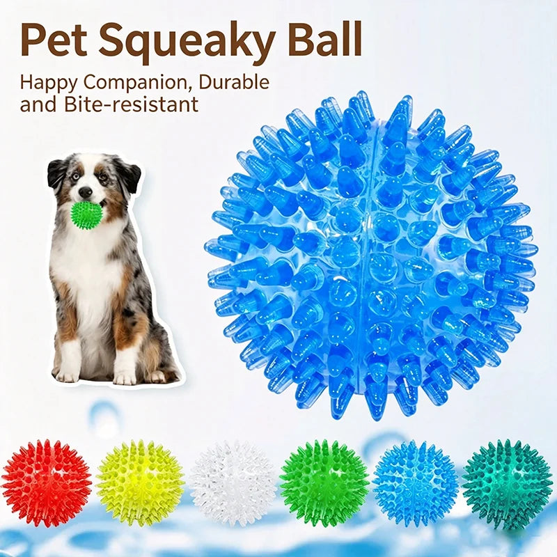 A collection of durable spiky squeaky dog balls in various colors including red, yellow, white, green, blue, and teal.
