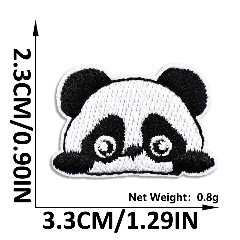 A black and white panda embroidered iron-on patch for clothing and DIY projects.