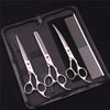 A black case holds a professional stainless steel pet grooming scissors set with a comb.
