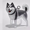 Clé-pendant en résine d'un chien Shiba Inu gris et noir sur fond blanc.