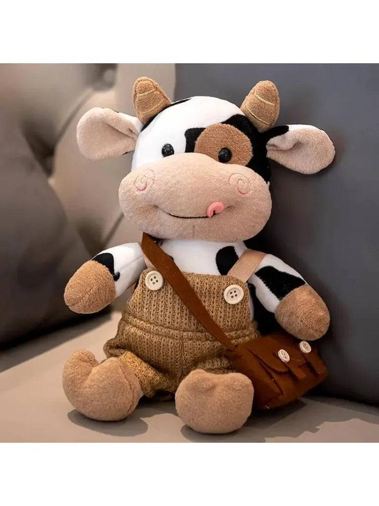 A plush toy resembling a cow with white and black markings, brown ears, and a brown leather bag.