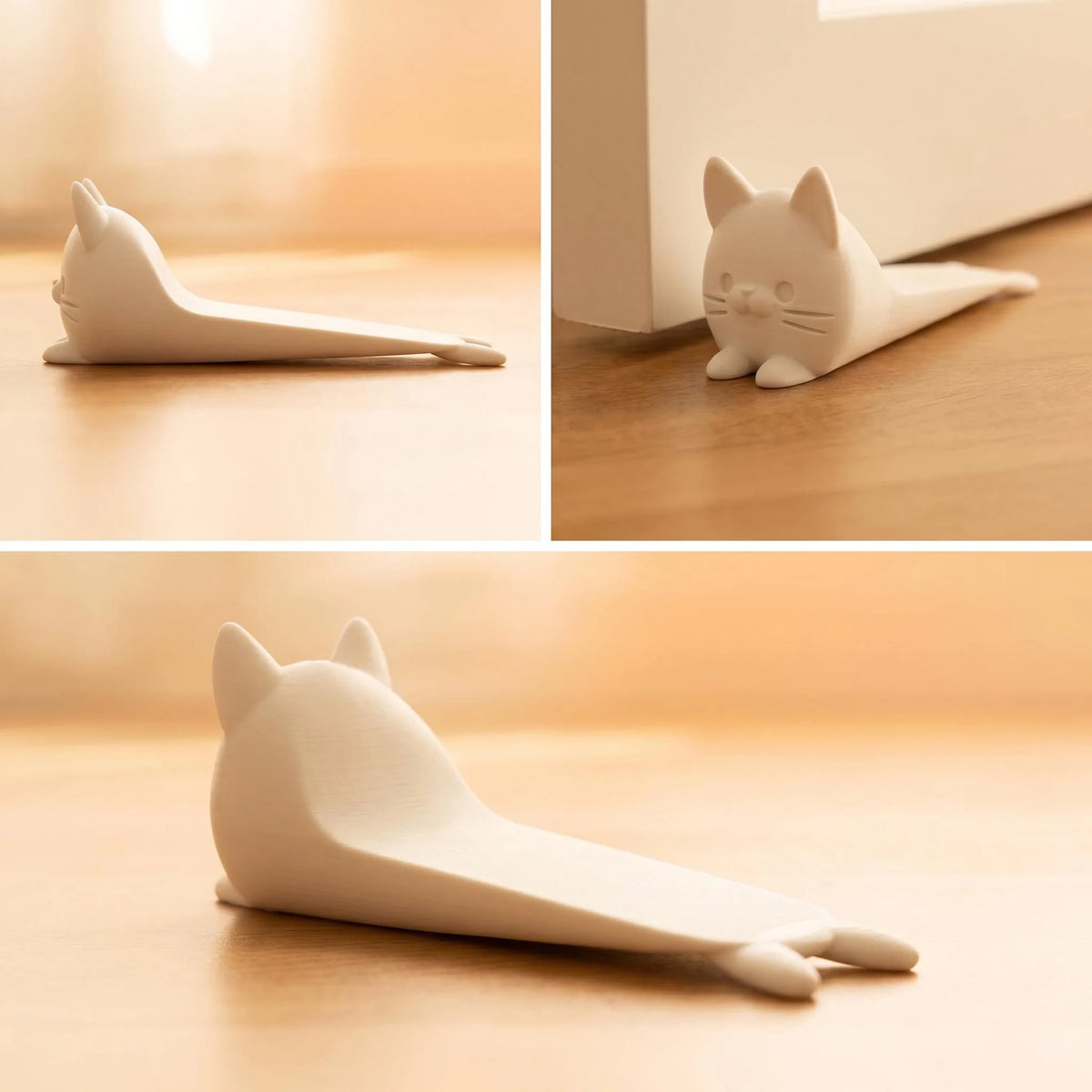 A white anti-slam door stopper wedge shaped like a cat, shown in different angles on a wooden surface.