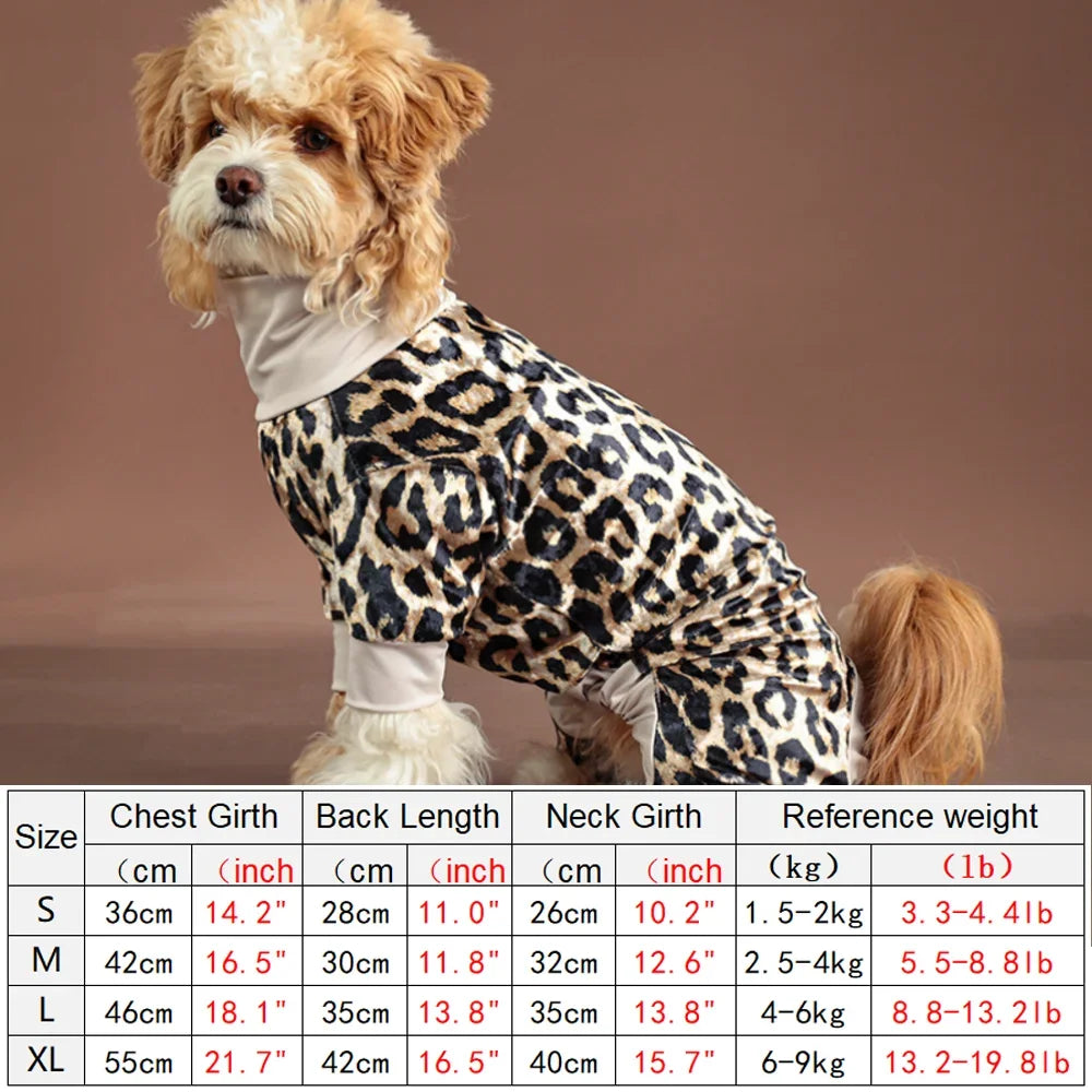 A small dog wearing leopard print pajamas with a light collar.
