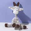 A white and brown plush toy shaped like a donkey with large ears.