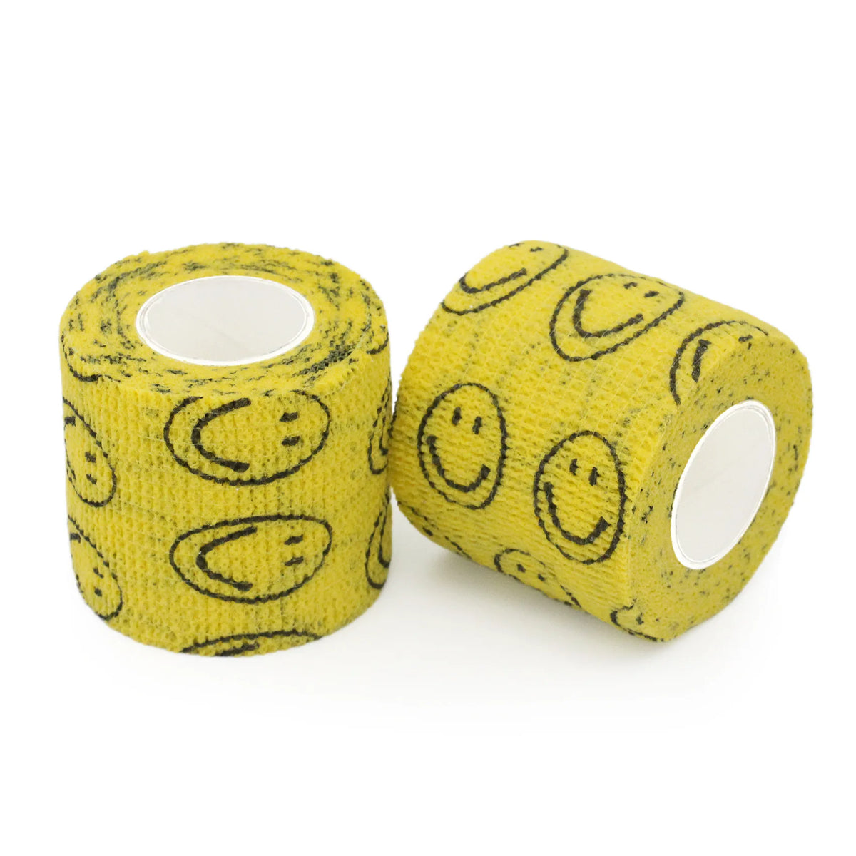Rollo de tela amarilla con patrones de cara sonriente negra, usado como vendas de agarre autoadhesivas para mascotas