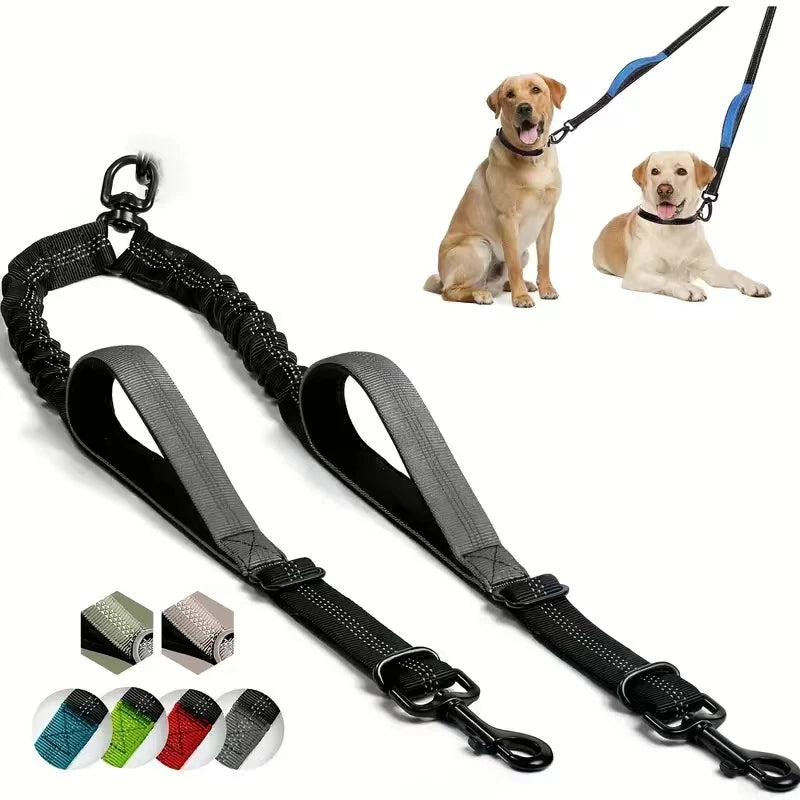 A dual dog leash coupler with padded handles and shock-absorbing bungee attached to a collar and leash.