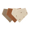 A set of three soft cotton baby bibs in shades of beige and brown.