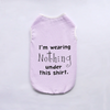 A light purple pet vest with black text that reads I'm wearing Nothing under this shirt.